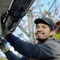 Who Cleans Gutters? Understanding Your Options for Home Maintenance